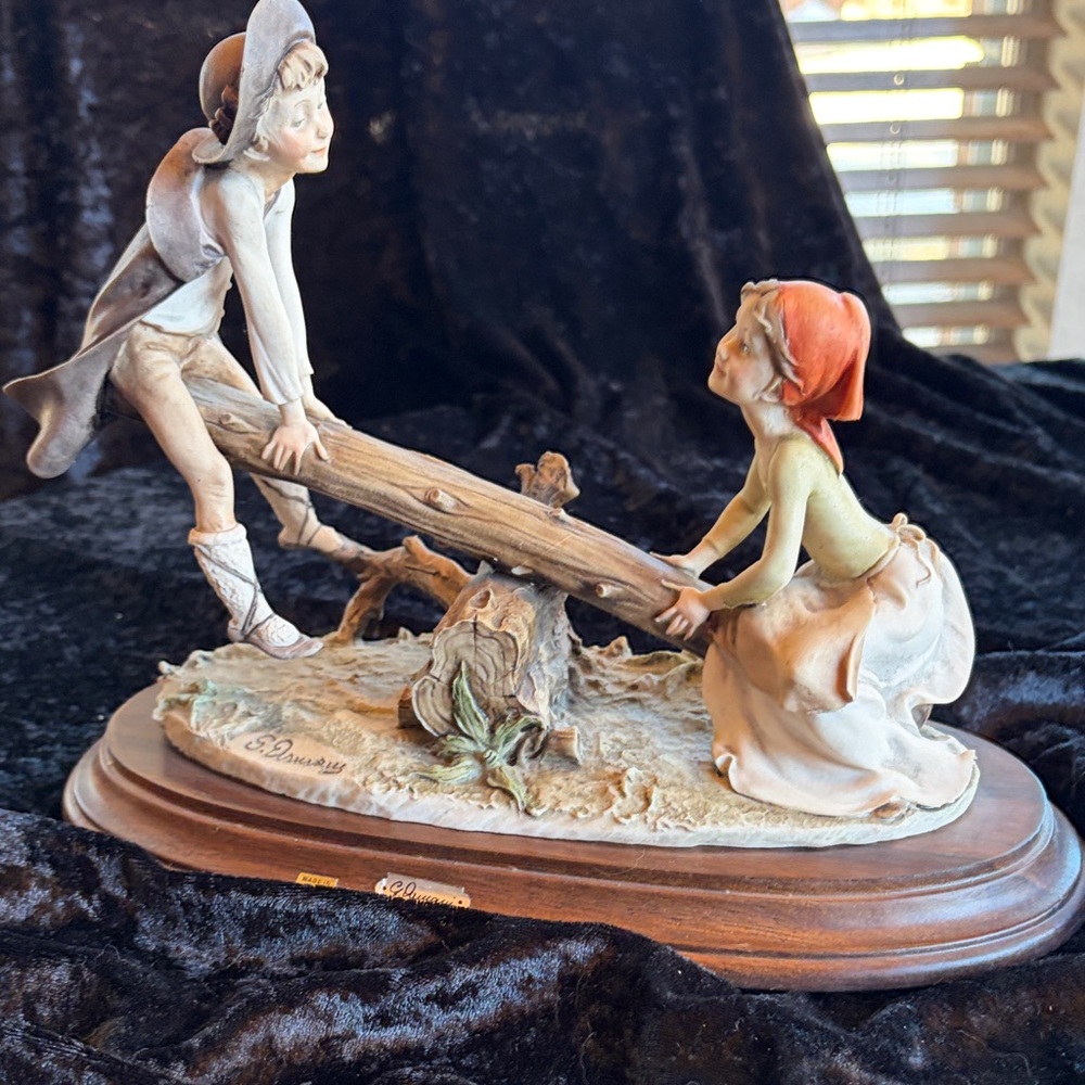 Delightful Seesaw Children Sculpture in Cream and muted colors